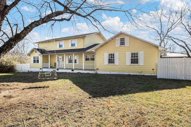 view of front of home featuring a front lawn and covered porch