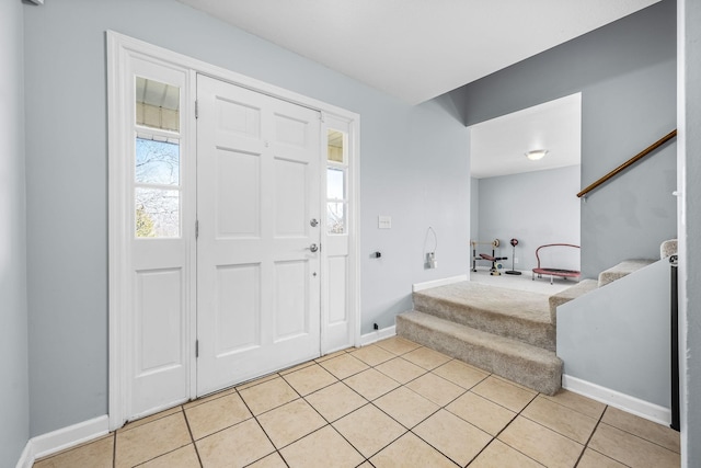 foyer entrance featuring light tile patterned floors