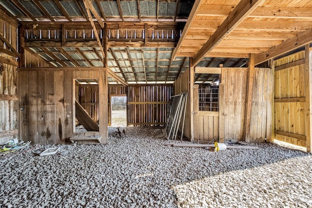 miscellaneous room featuring wooden walls