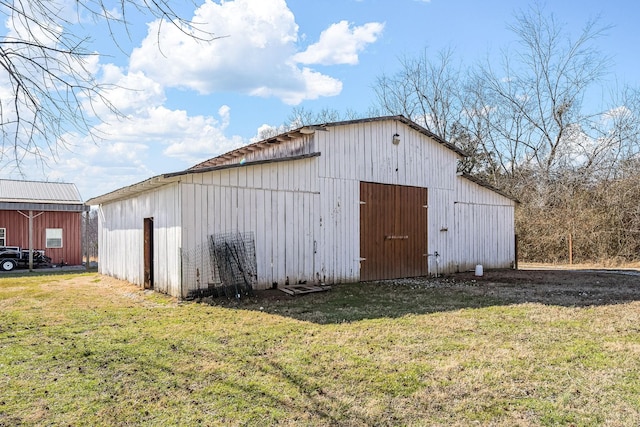 view of outdoor structure with a lawn