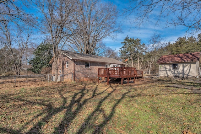 view of yard featuring a deck and a shed