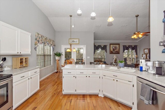 kitchen featuring white cabinetry, appliances with stainless steel finishes, sink, and pendant lighting