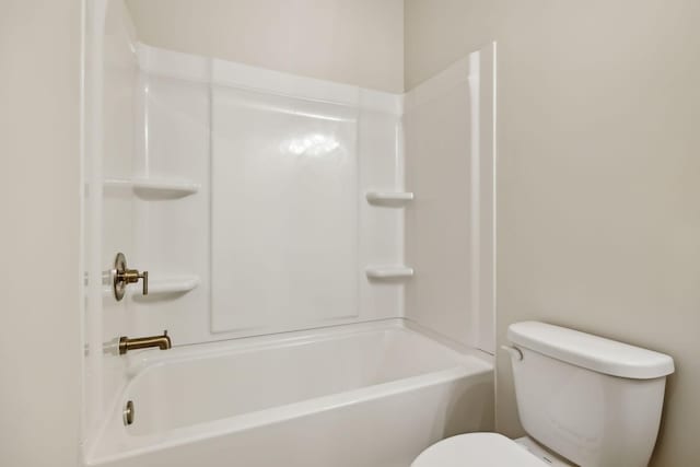 bathroom with toilet and shower / bath combination