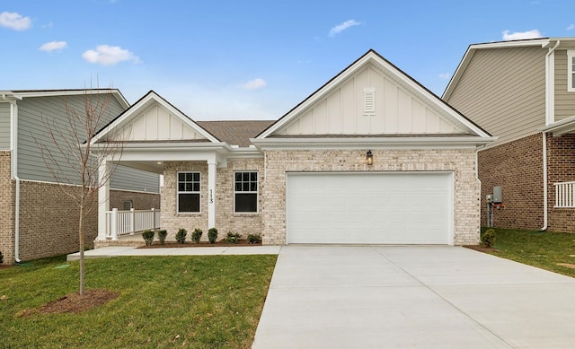 craftsman-style house featuring a garage and a front yard