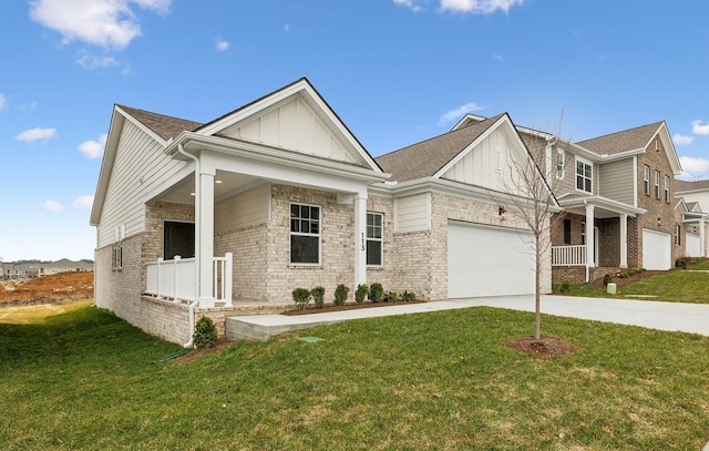 craftsman inspired home featuring a garage and a front lawn