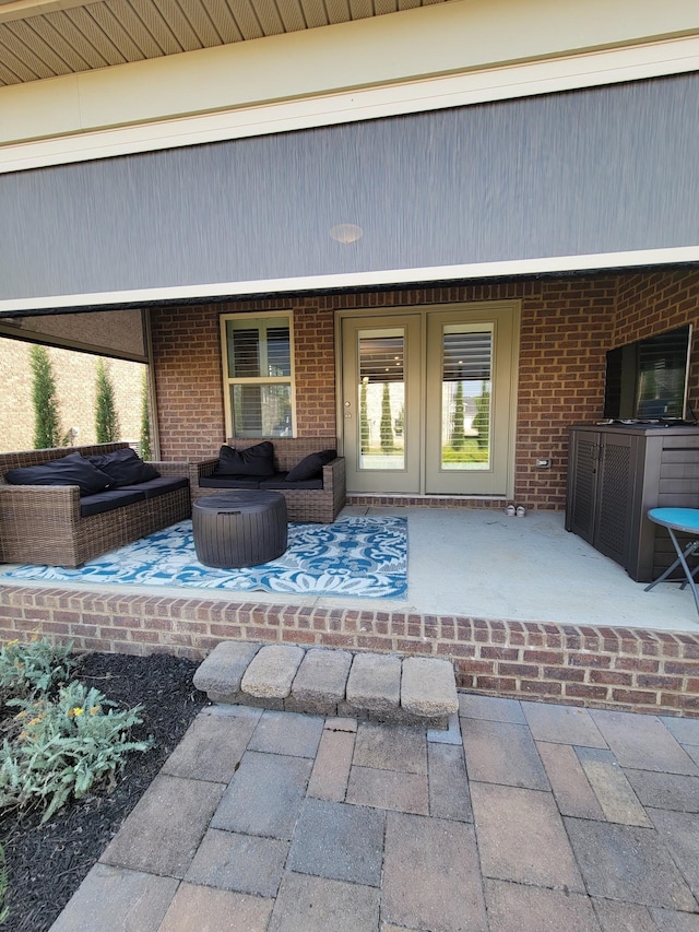 view of patio / terrace with french doors and an outdoor living space