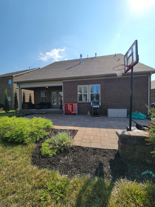 rear view of property featuring a patio area