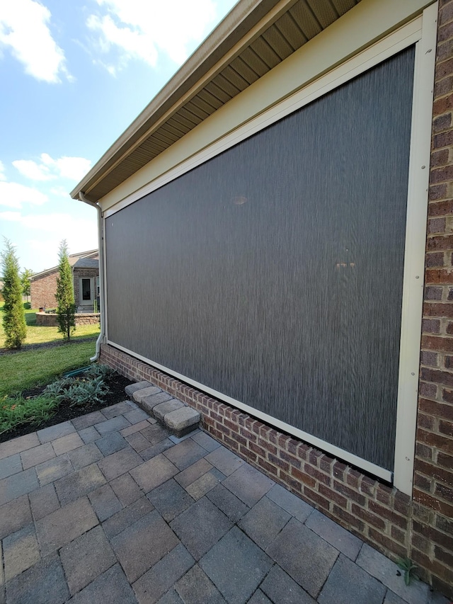 view of side of property with a patio area