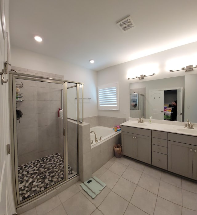 bathroom featuring tile patterned floors, vanity, and independent shower and bath