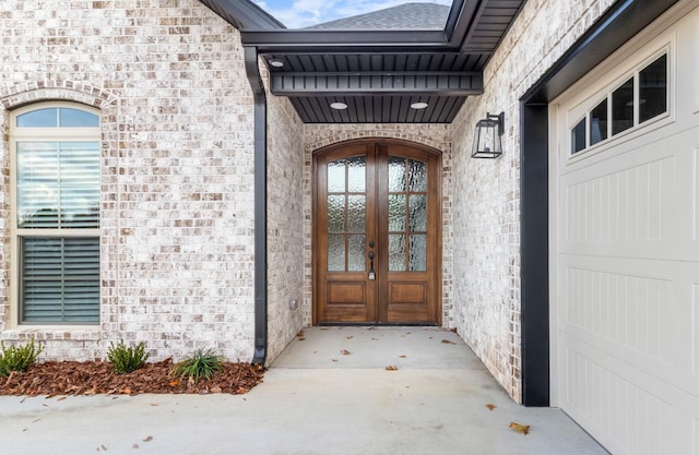 view of exterior entry featuring french doors