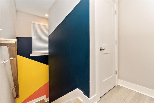 corridor with light hardwood / wood-style floors