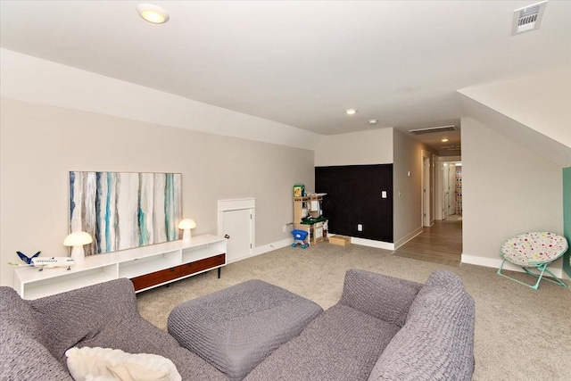 living room with vaulted ceiling and carpet