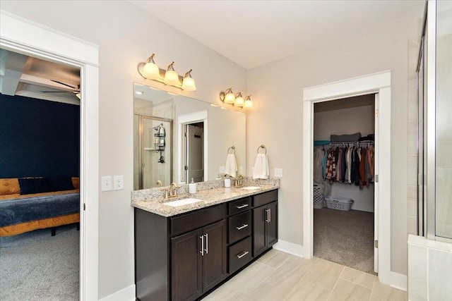 bathroom with vanity and an enclosed shower