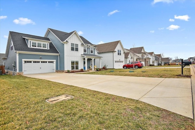 view of front of house featuring a garage and a front yard