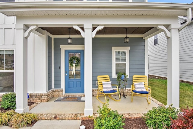 doorway to property featuring covered porch