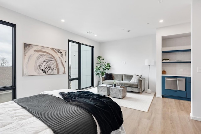 bedroom with light hardwood / wood-style floors