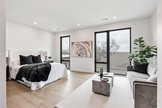 bedroom with light hardwood / wood-style flooring