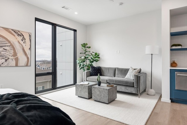 living room with light hardwood / wood-style flooring