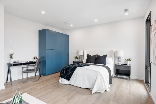 bedroom with light hardwood / wood-style floors