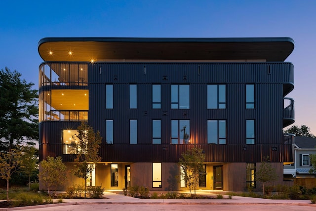 view of outdoor building at dusk