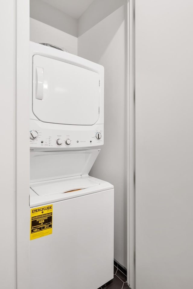 laundry area with stacked washer and clothes dryer