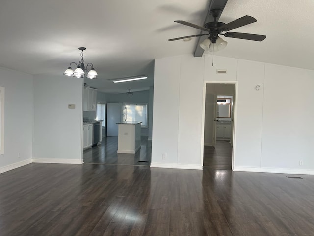 unfurnished living room featuring dark hardwood / wood-style flooring, vaulted ceiling with beams, and ceiling fan with notable chandelier