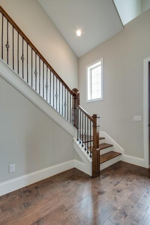 stairway featuring hardwood / wood-style flooring