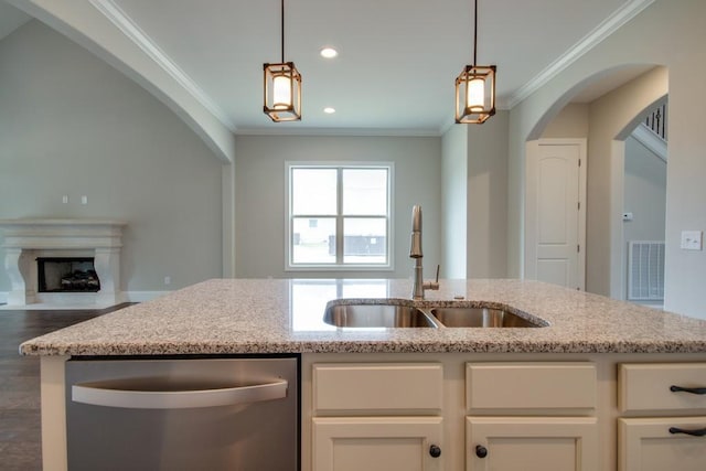 kitchen with sink, dishwasher, ornamental molding, light stone countertops, and white cabinets