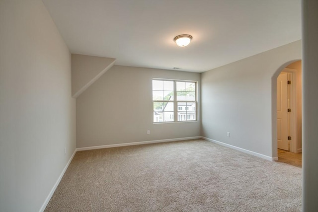 bonus room with light colored carpet