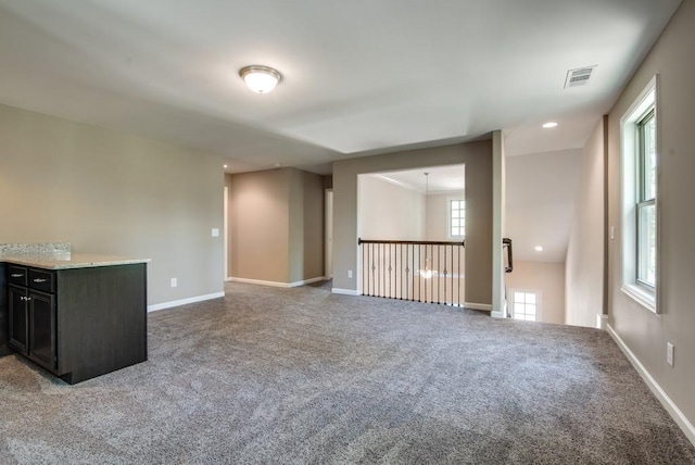 unfurnished living room featuring carpet floors