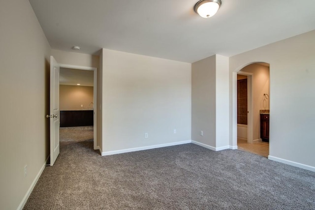 unfurnished room featuring carpet flooring