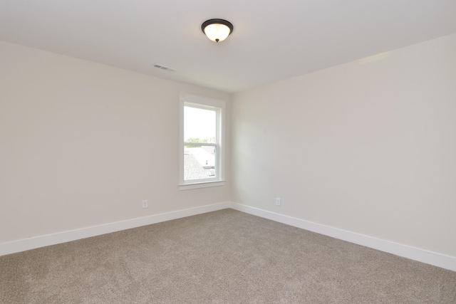 unfurnished room featuring carpet