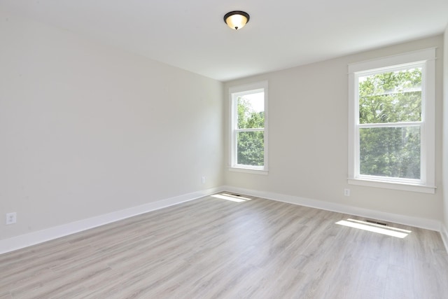 empty room with light wood-type flooring