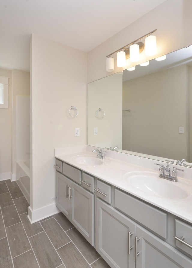 bathroom with vanity and bathing tub / shower combination