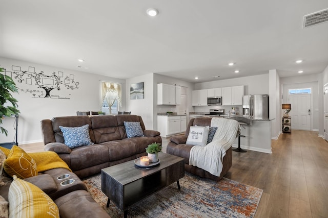 living room with dark wood-type flooring