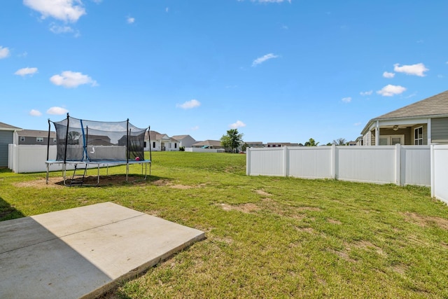 view of yard with a patio area and a trampoline