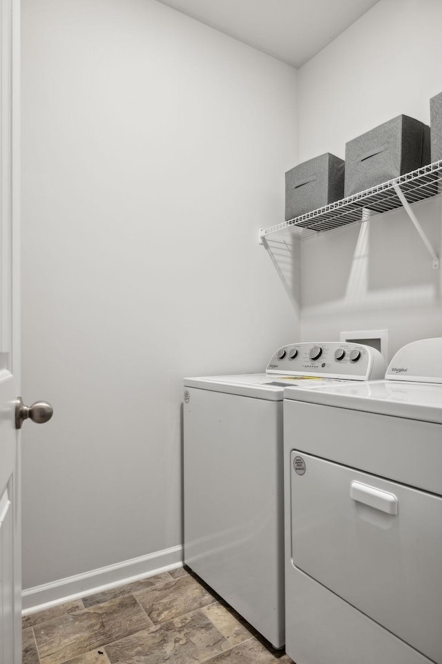 clothes washing area featuring hardwood / wood-style flooring and washing machine and clothes dryer