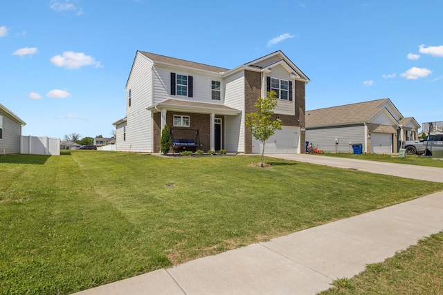 view of front of home with a garage and a front yard