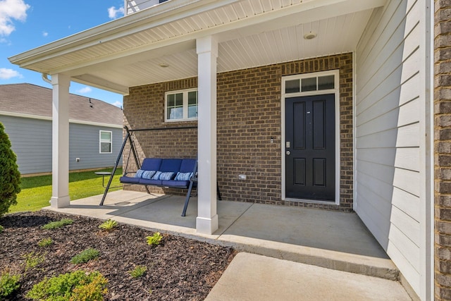 property entrance with covered porch