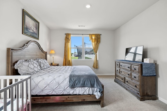 bedroom with light carpet