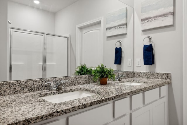 bathroom featuring vanity and walk in shower