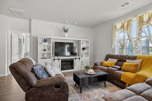 living room with light hardwood / wood-style flooring