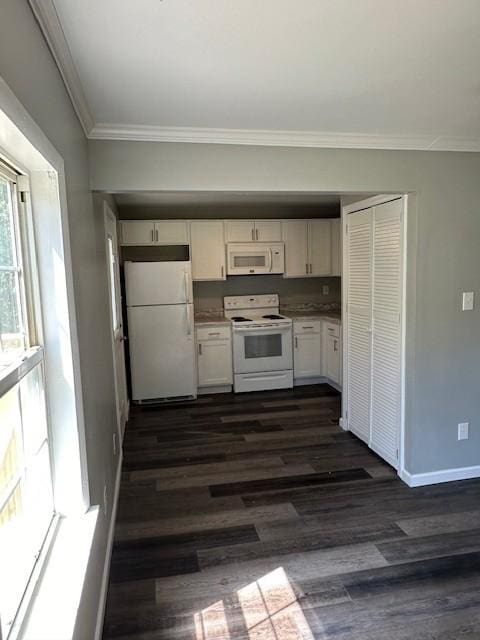 kitchen with dark hardwood / wood-style floors, white cabinetry, crown molding, and white appliances