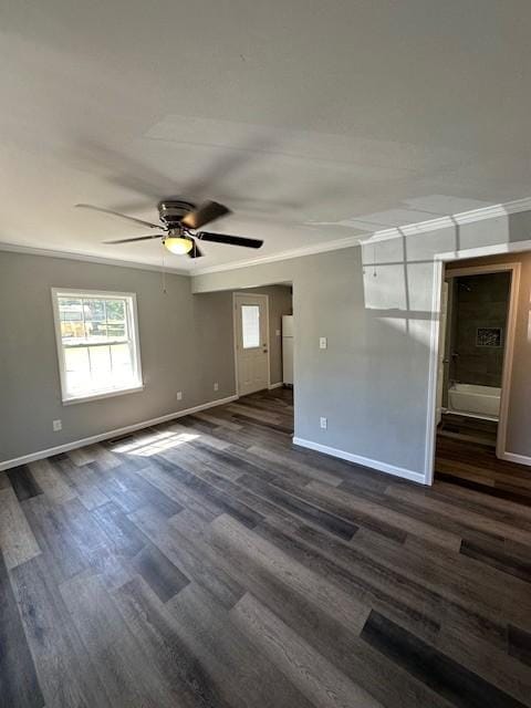 unfurnished room with dark wood-type flooring, ornamental molding, and ceiling fan