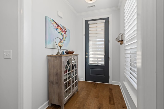 doorway with ornamental molding and hardwood / wood-style floors