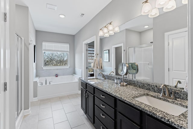 bathroom with vanity, tile patterned floors, and independent shower and bath