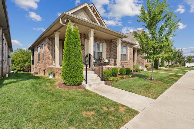 view of front of property featuring a front yard and covered porch