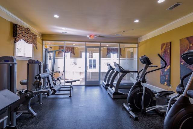 workout area featuring ornamental molding