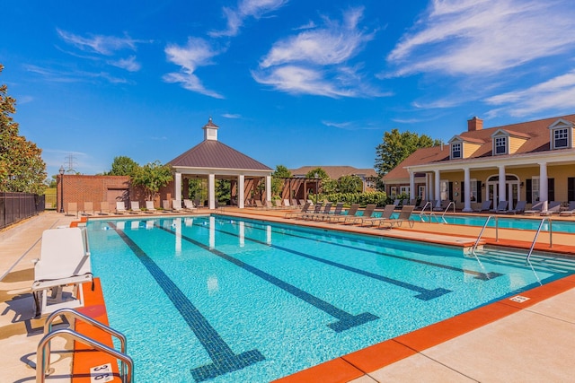 view of pool featuring a gazebo and a patio