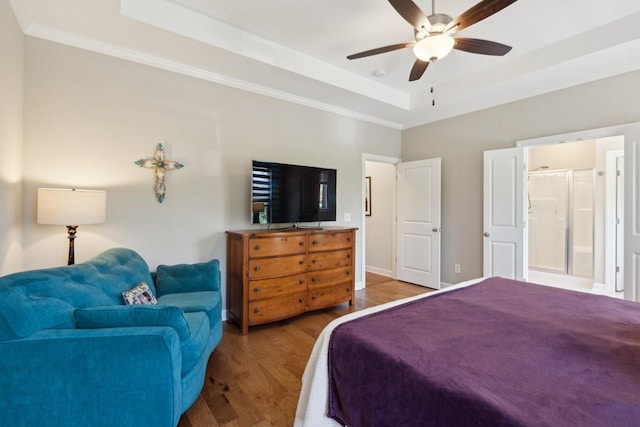 bedroom featuring wood-type flooring, ornamental molding, a raised ceiling, and ceiling fan